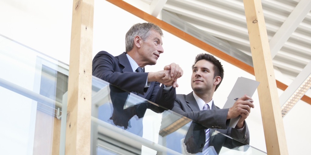 Businessmen having conversation in modern office